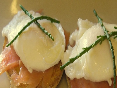 photo of poached eggs with smoked salmon on english breakfast muffins