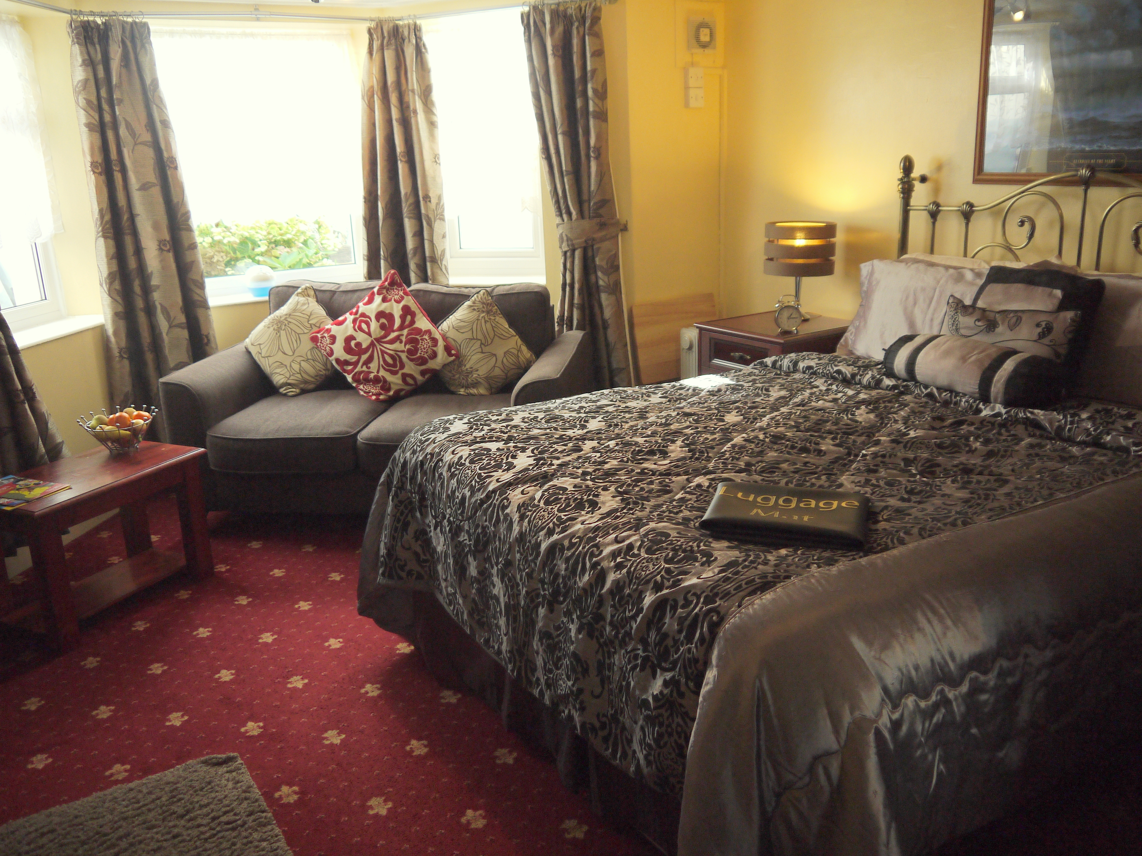 photo of the luxury king room including the king bed and the sofa